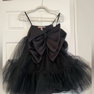 Black mini tulle dress with bow. Never worn. Adjustable spaghetti straps. NWT
